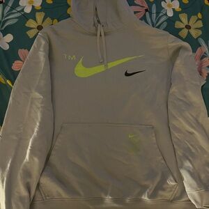 I am selling a grey Nike Hoodie.